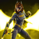 Batgirl poses in front of a gold-lit bat symbol.